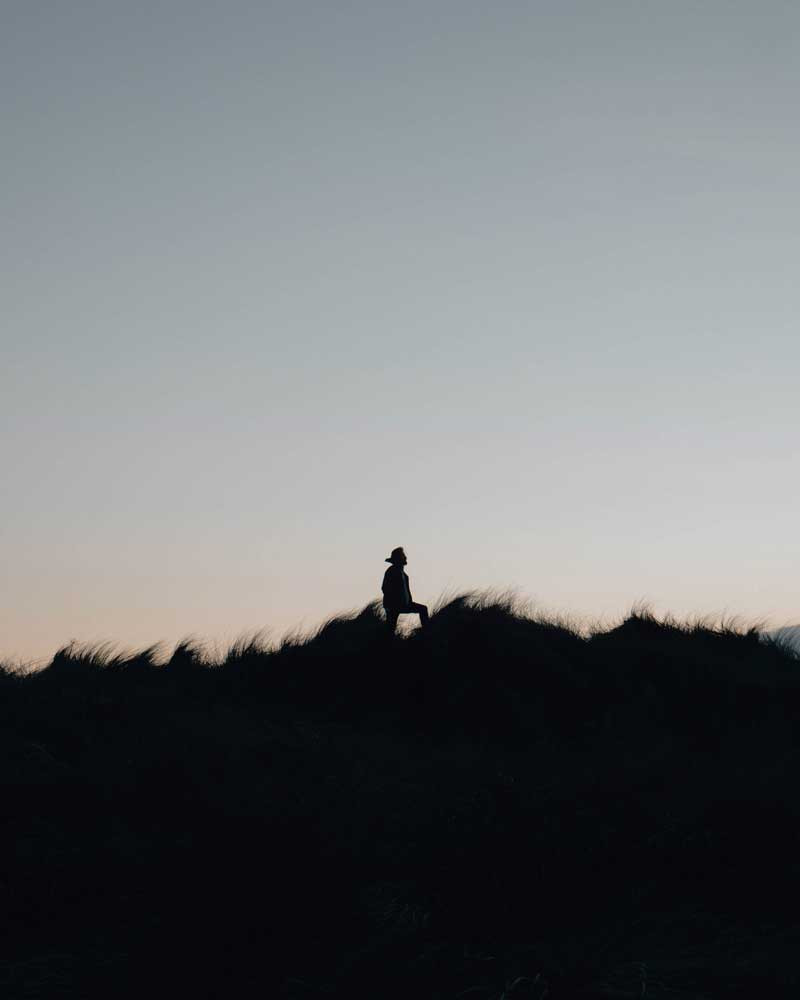 a person walking across a field