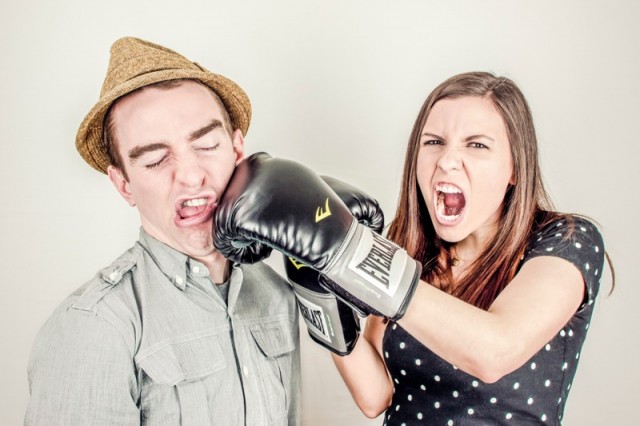 man and women fighting