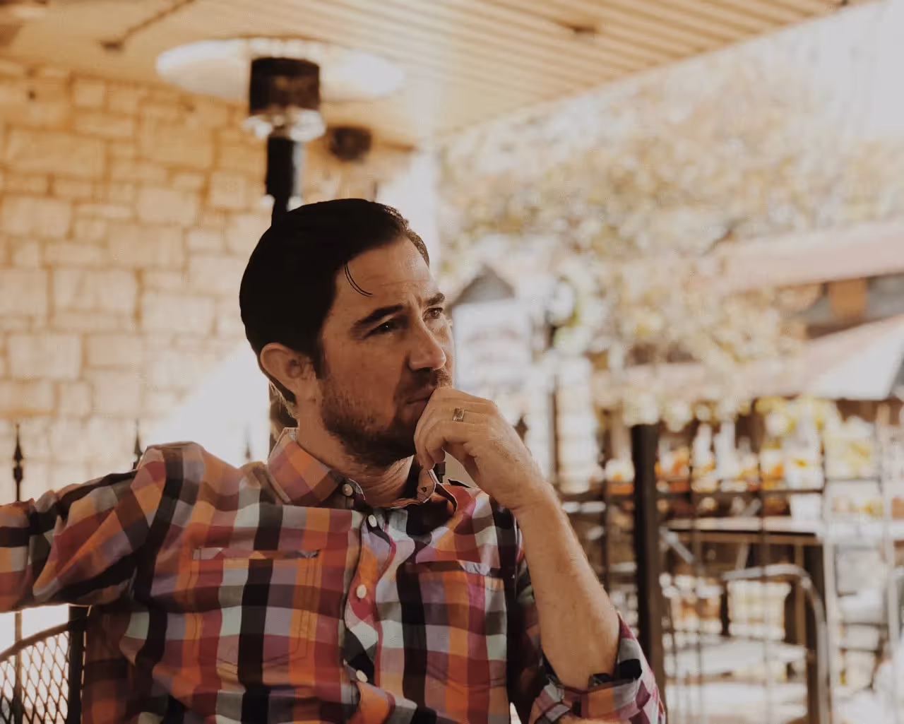 A depressed man siting by himself