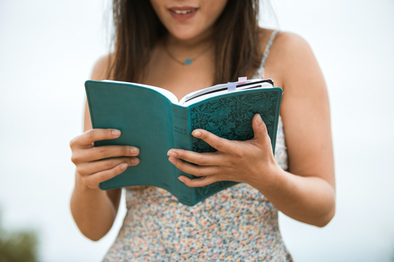 A woman reading a bible