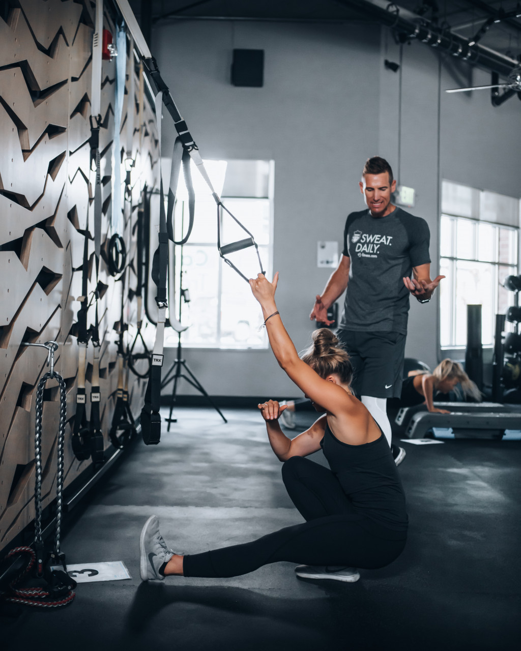 A couple working out together at the gym
