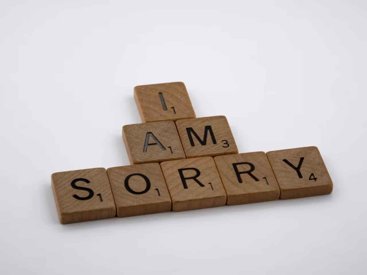 I am sorry spelled out with scrabble tiles