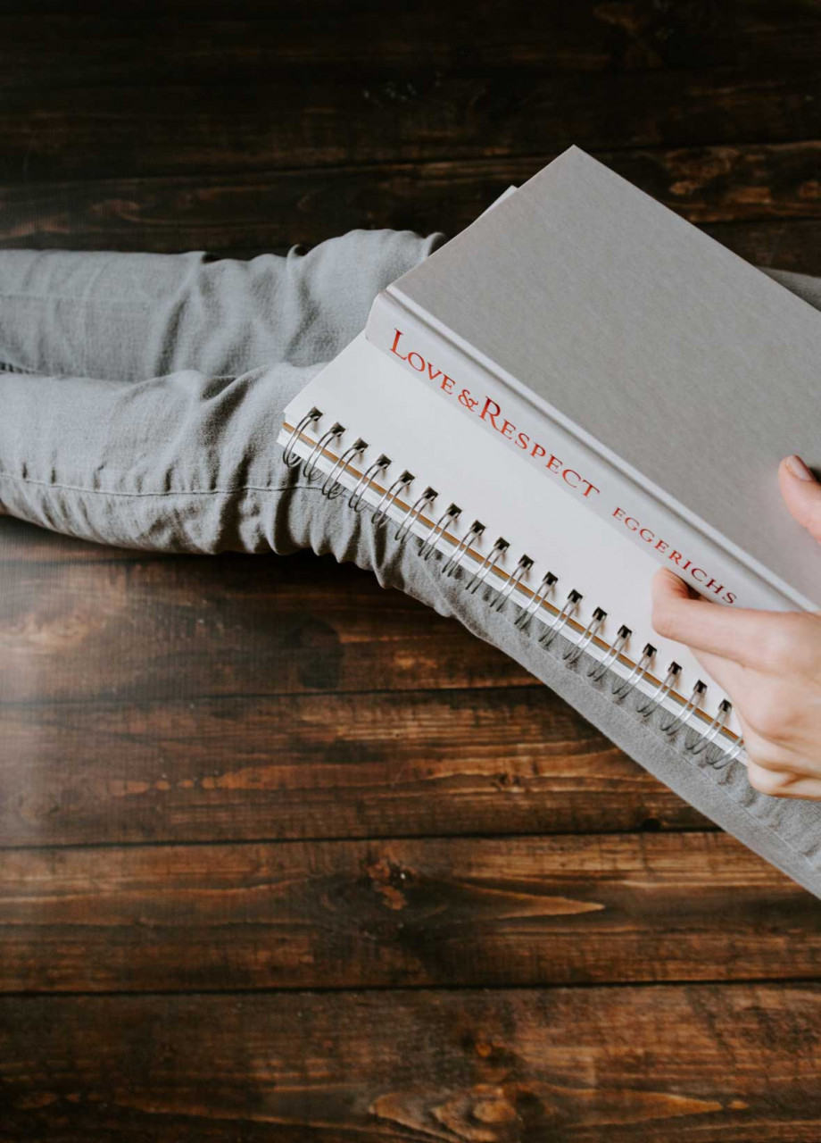 a person holding a notebook saying love and respect