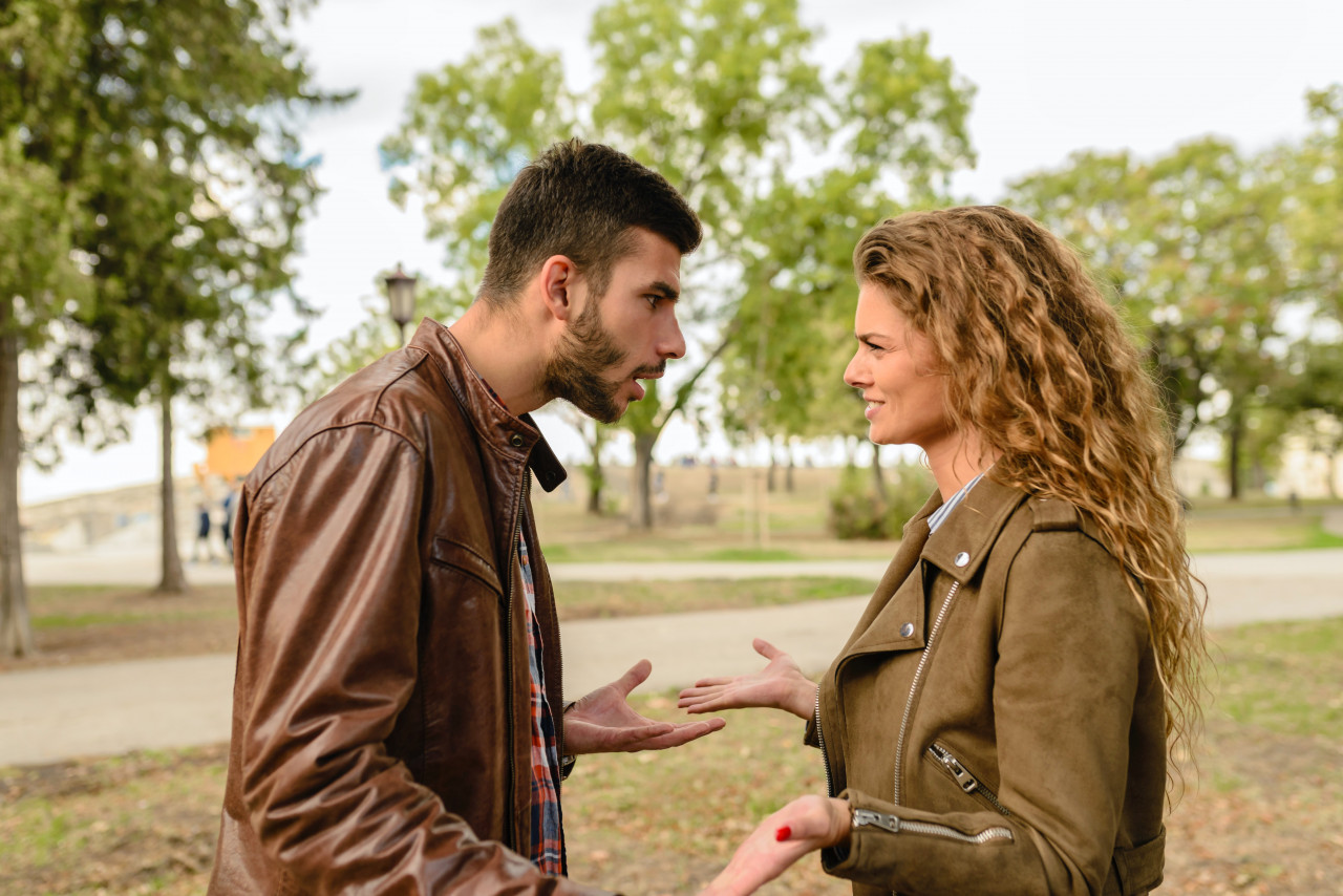 a couple having an argument outside