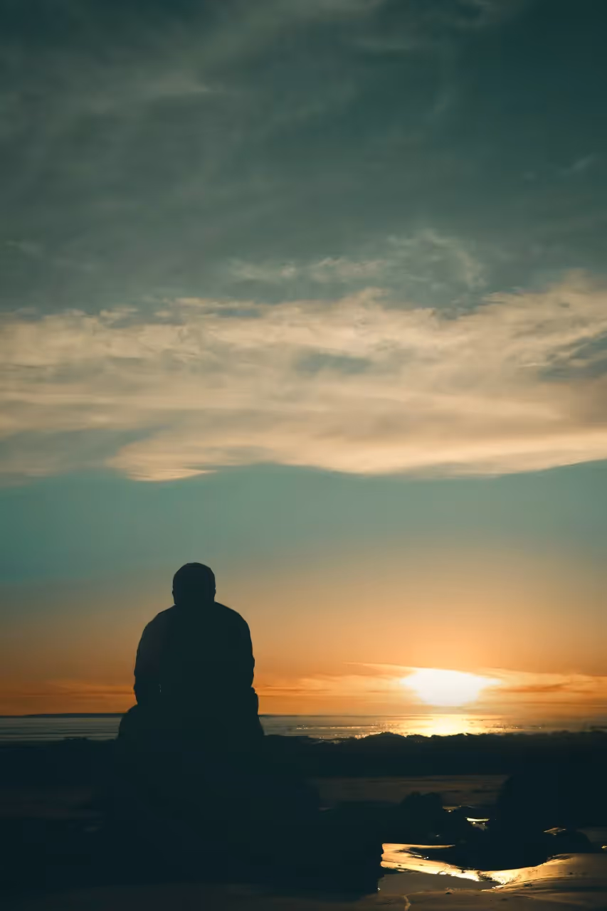 a person looking at a waterfront