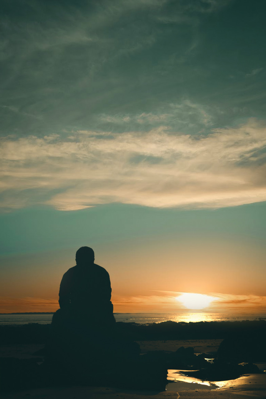 a person looking at a waterfront