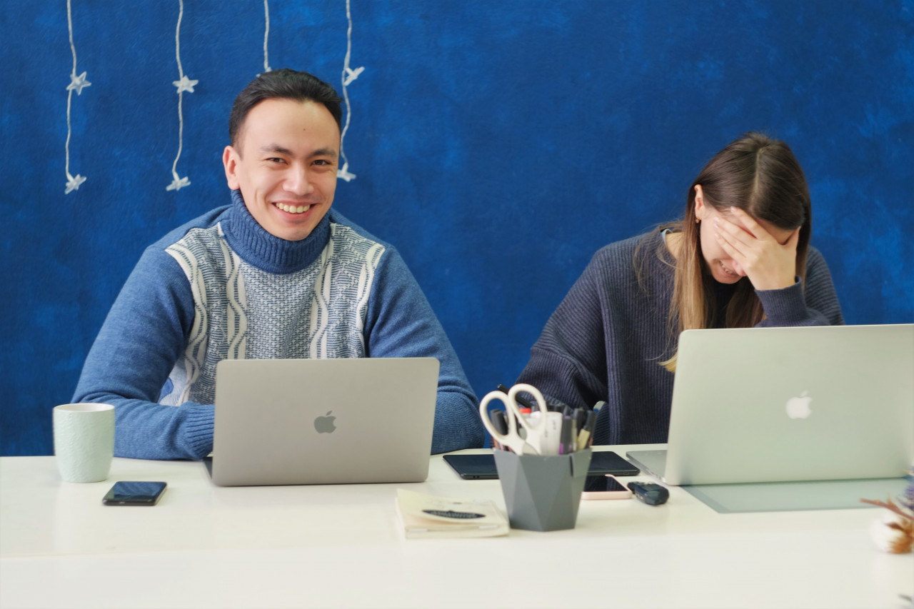 Coworkers sharing a joke.