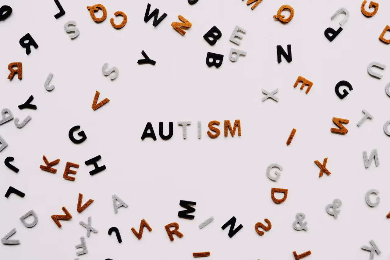 The word Autism surrounded by scattered letters
