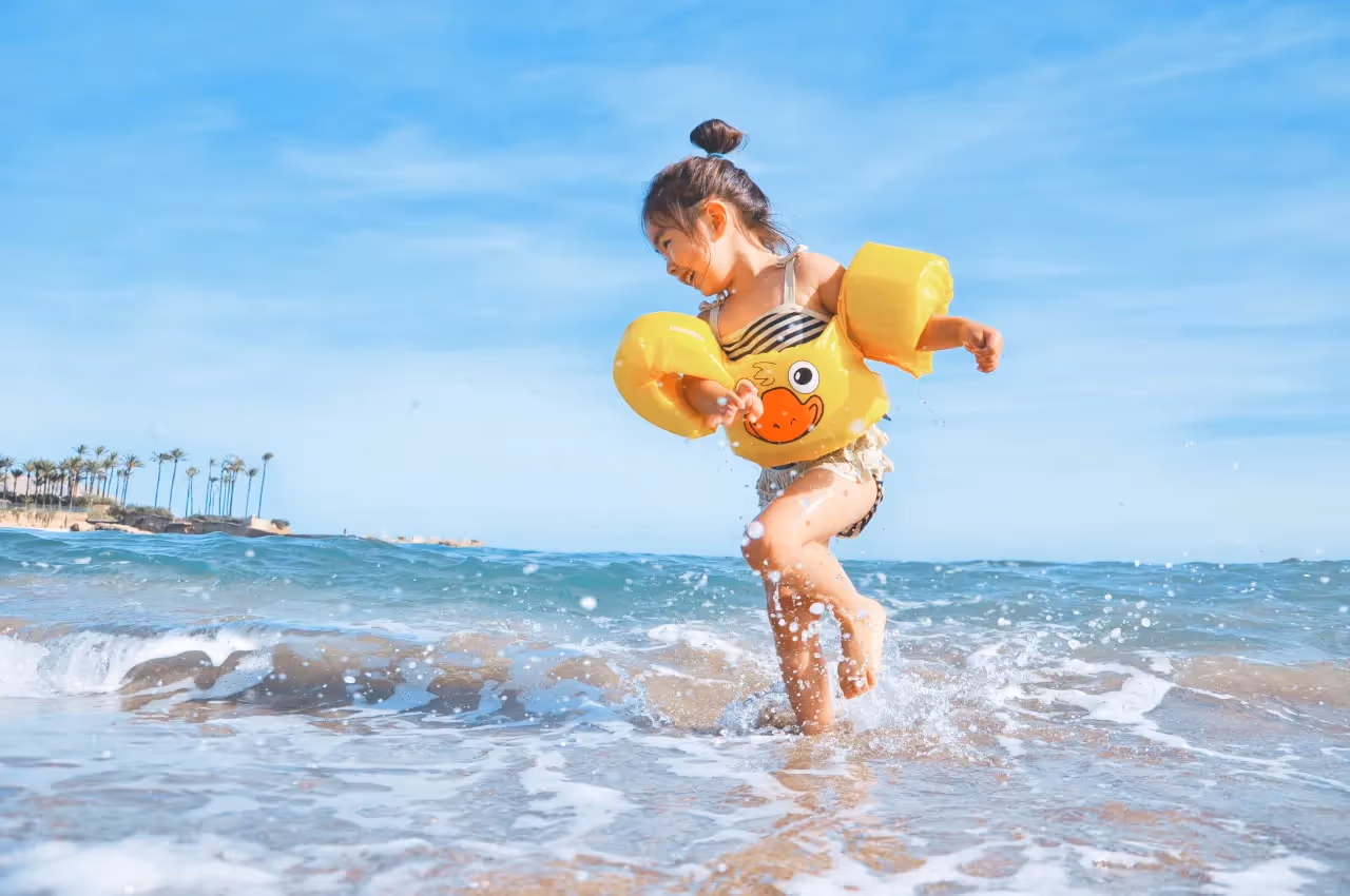 A child playing in the water.