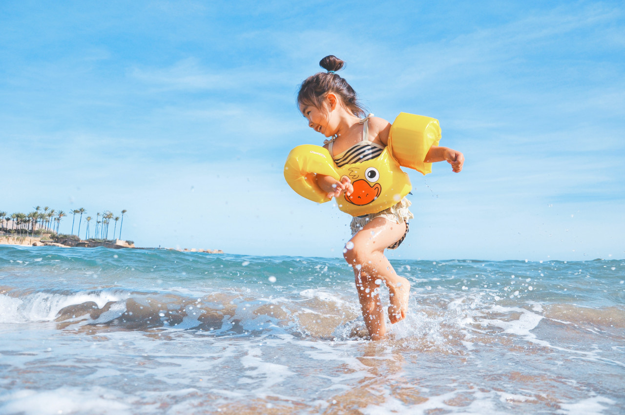 A child playing in the water.