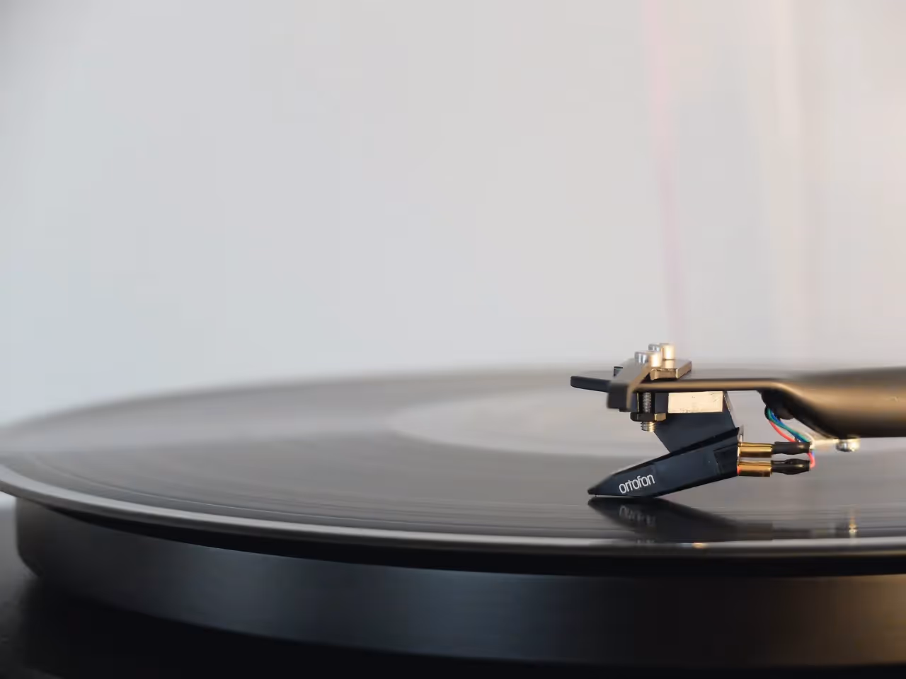 A vinyl record on play.