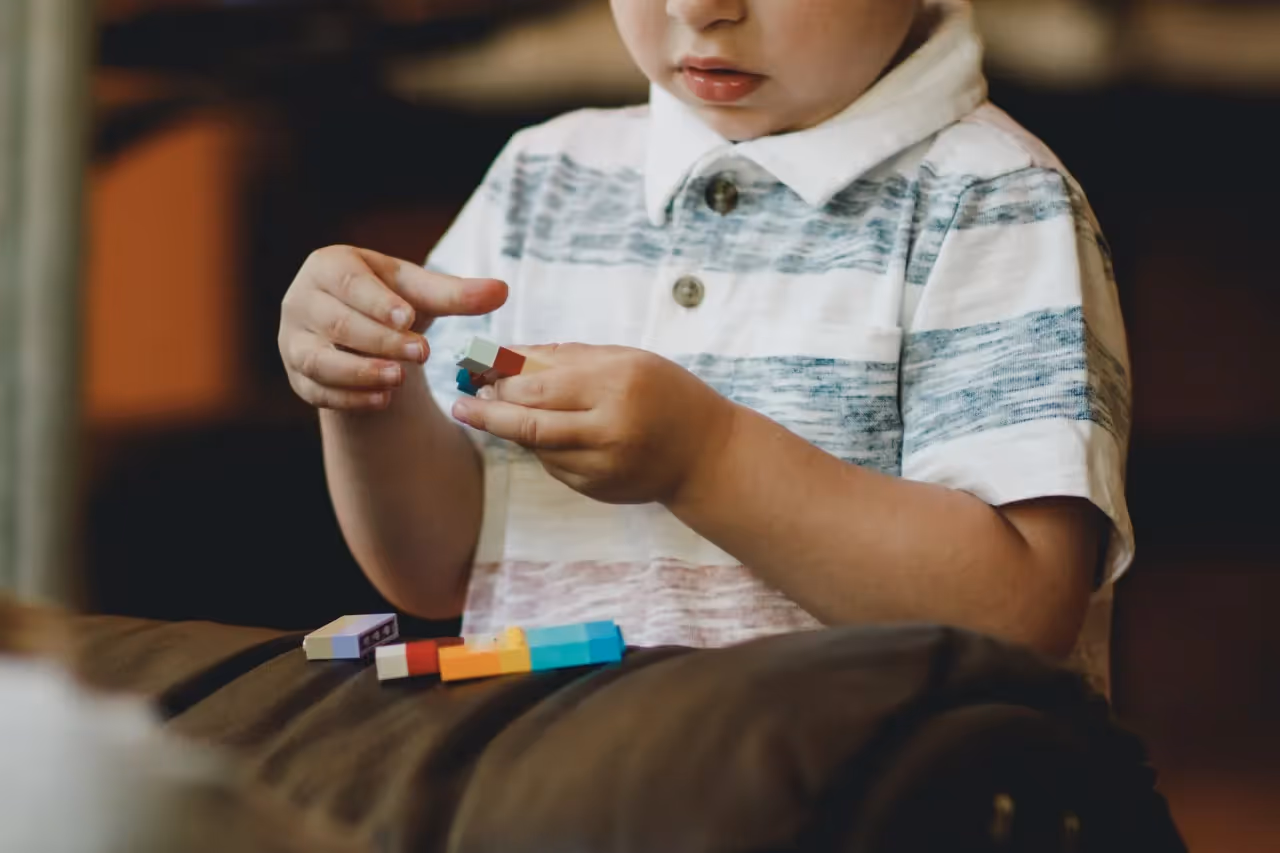 Little boy playing with legos
