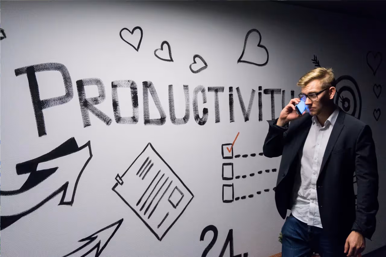 A man beside a productivity diagram.