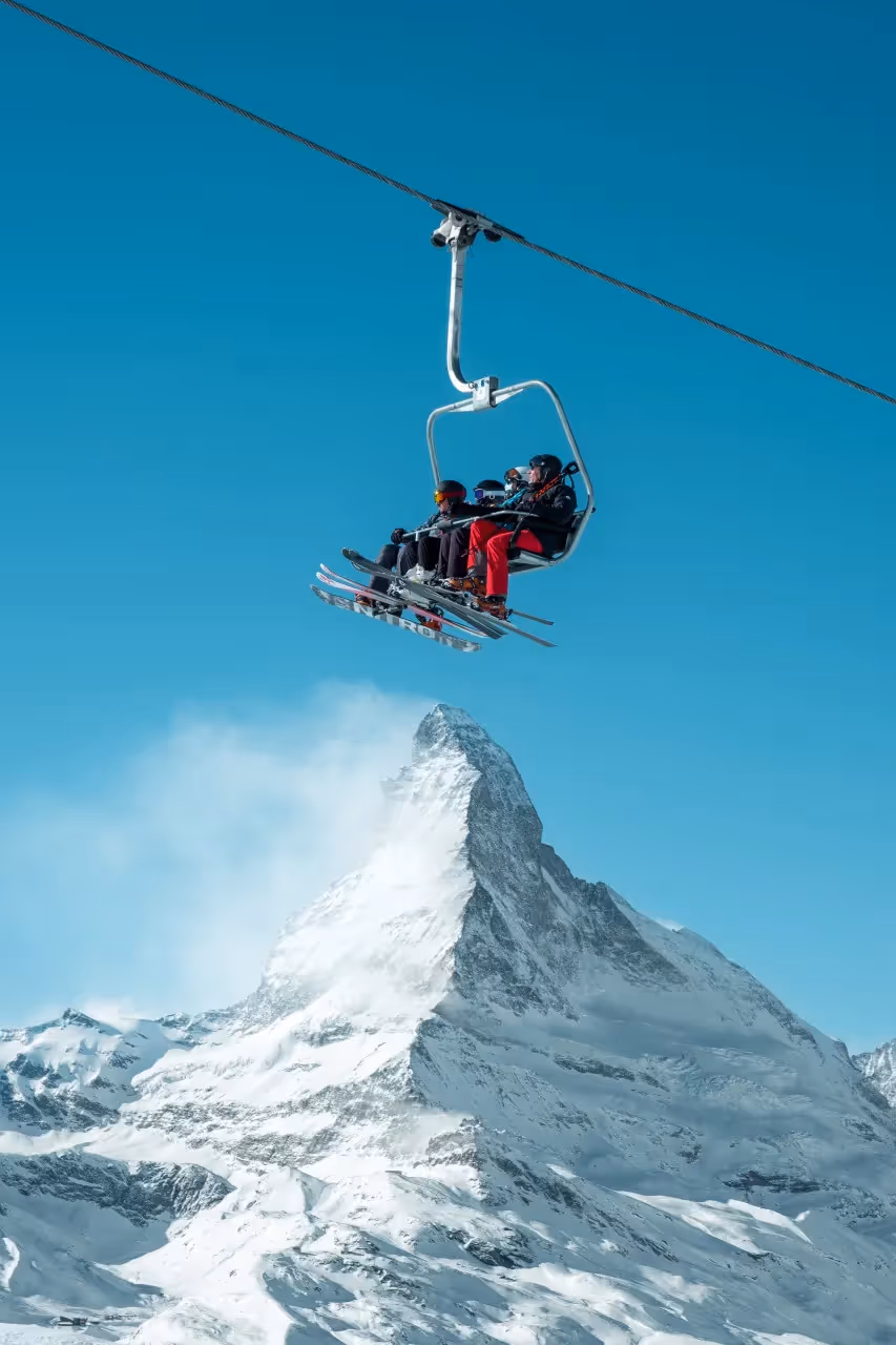 A skiing family hanging out together.