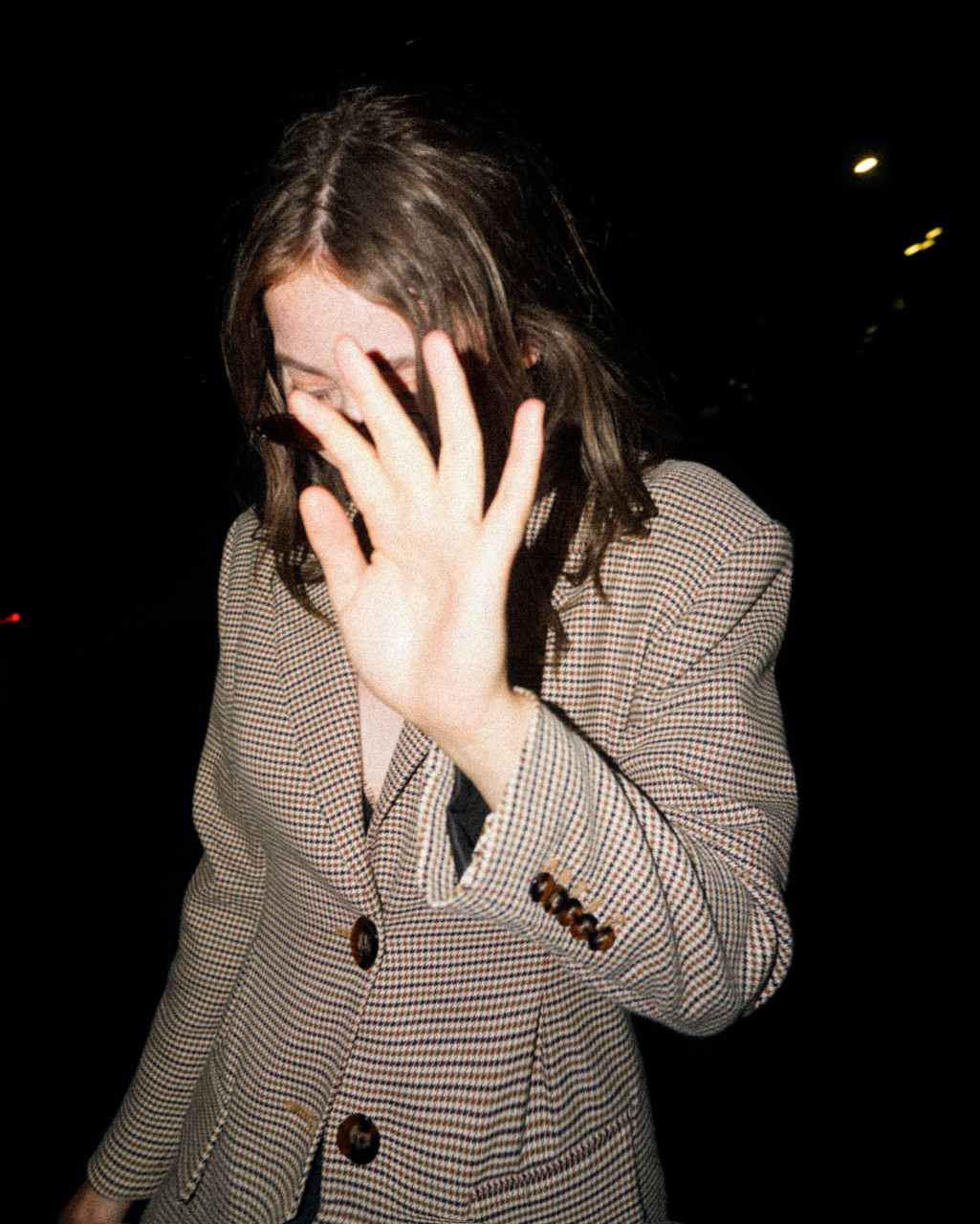 A celebrity trying to escape a photograph.