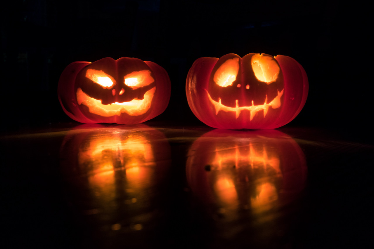 Two Halloween-themed pumpkins.