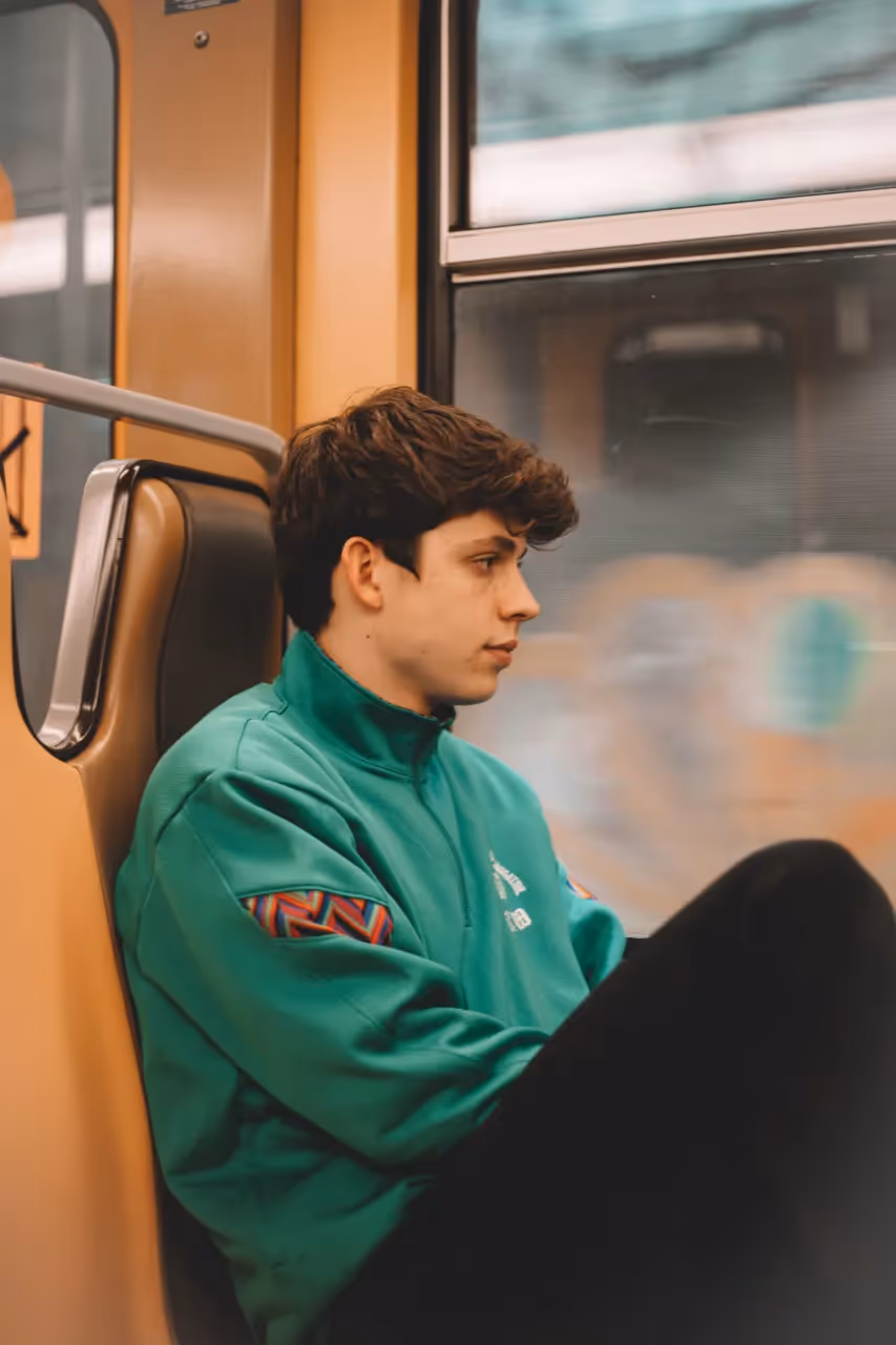 A man sitting in a bus.