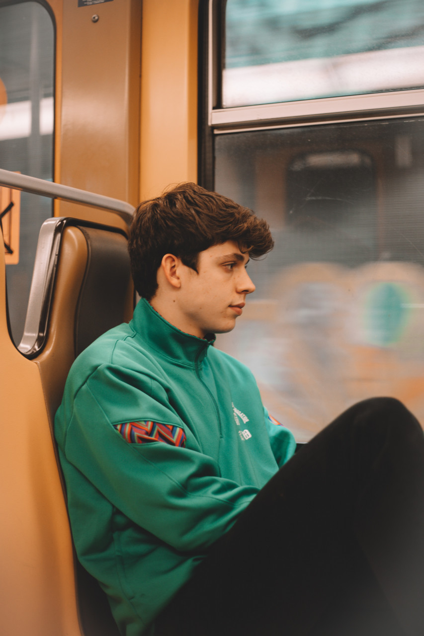 A man sitting in a bus.