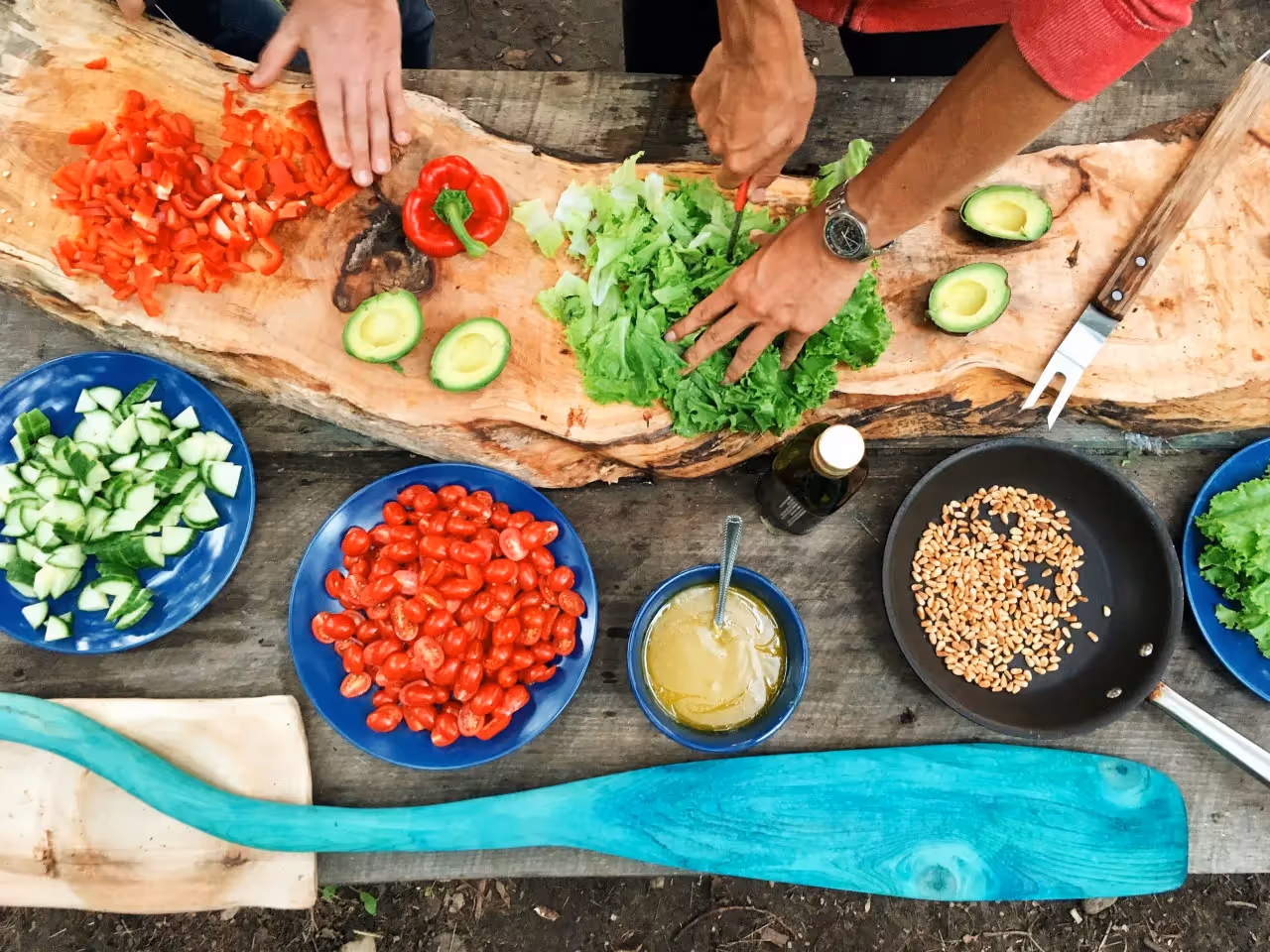 Two persons doing meal prep.