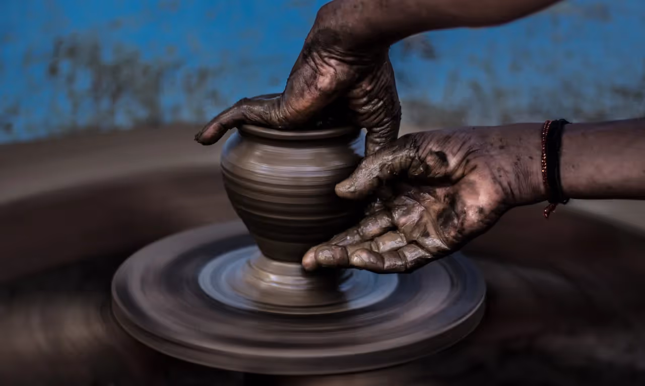 A potter creating a piece.