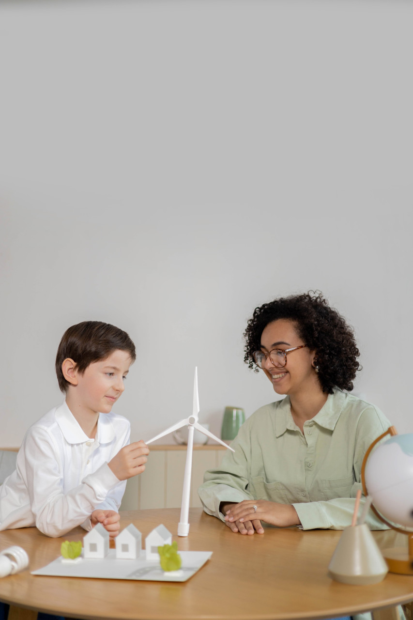 A teacher helping a student.