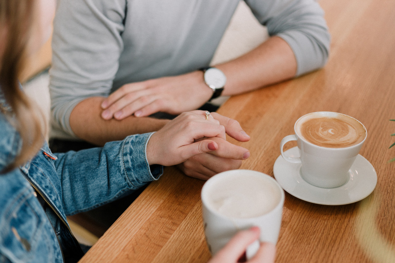 A couple on a romantic coffee date.