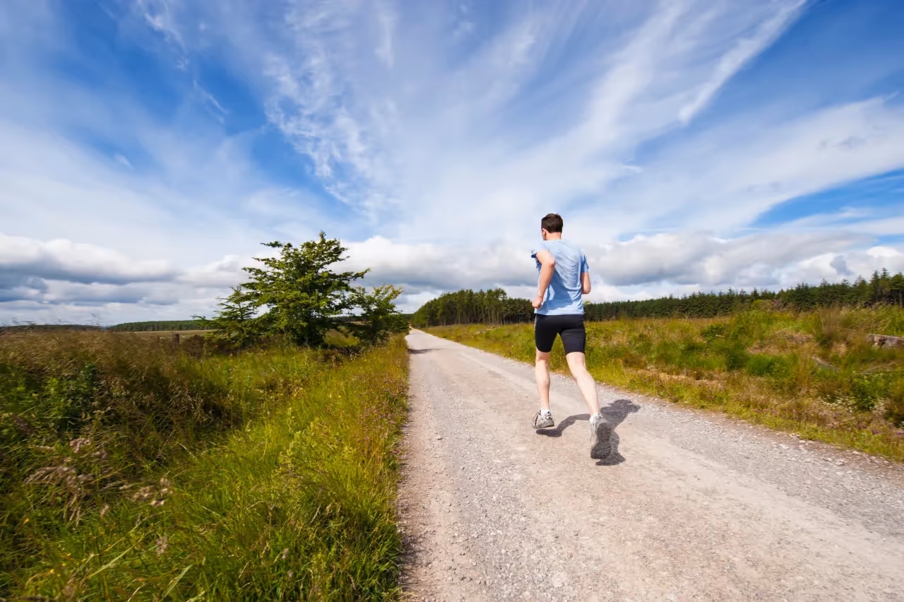 A man using jogging as his means of exercise.