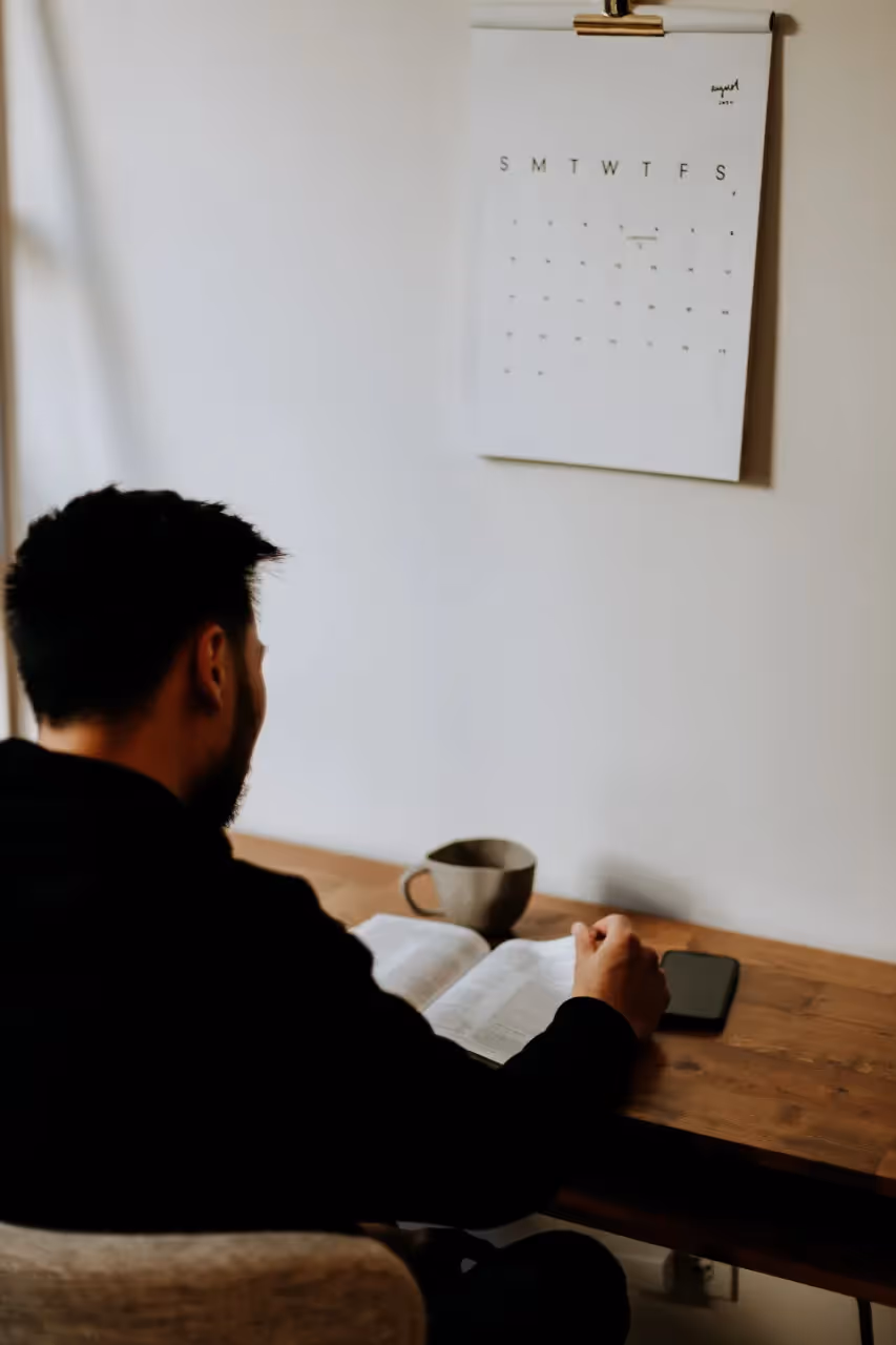 A man learning real facts from a book.