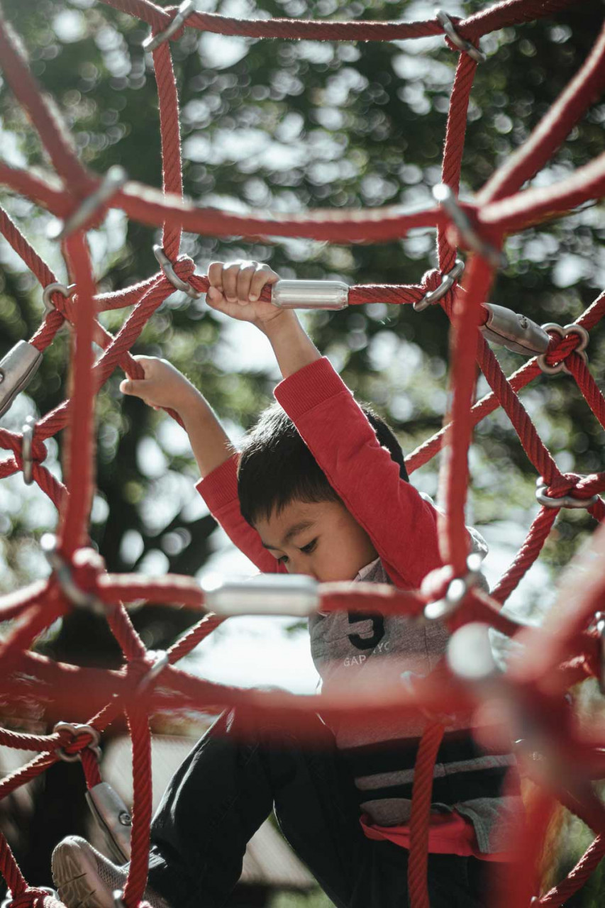 kid climbing on playground