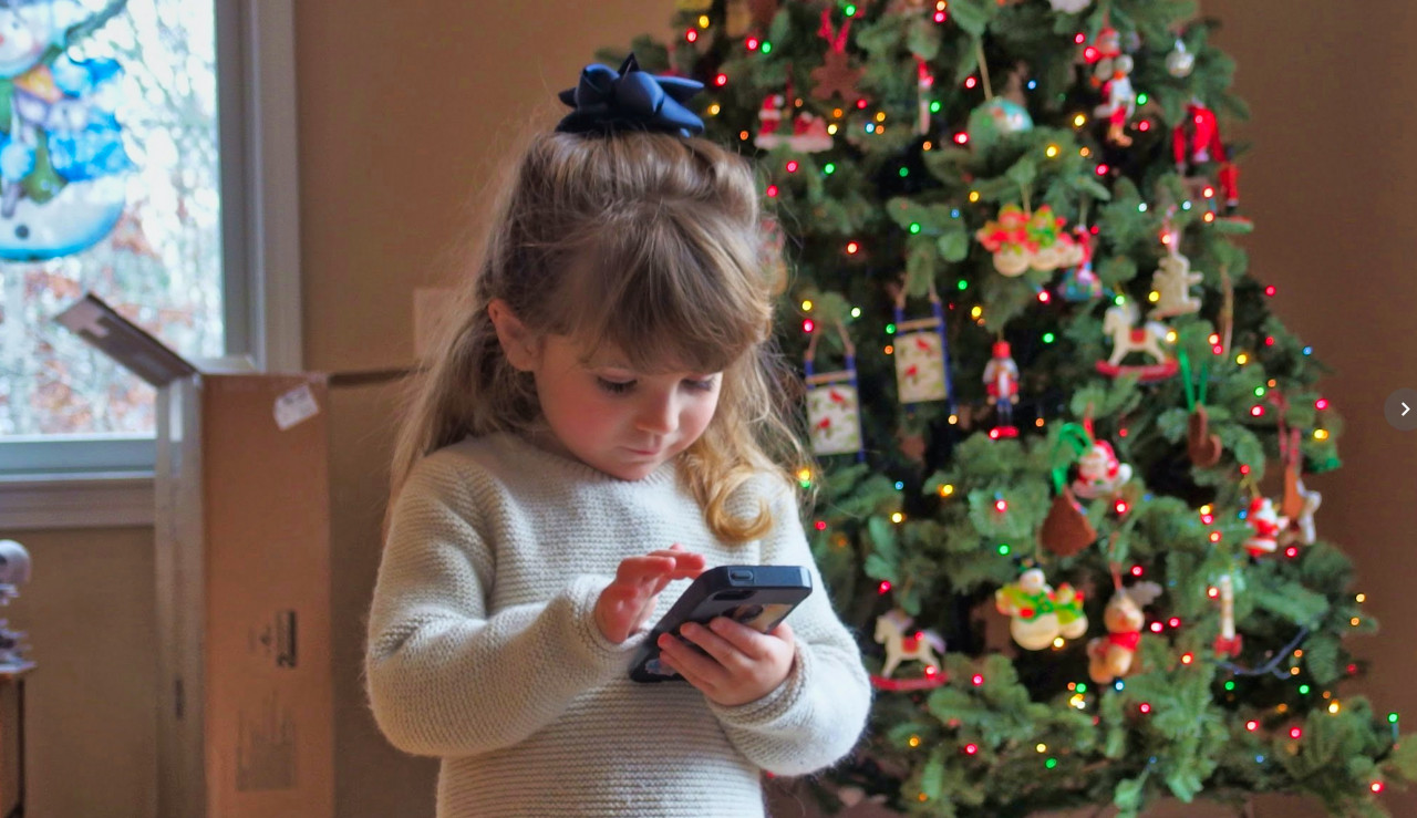 A child using a mobile device.