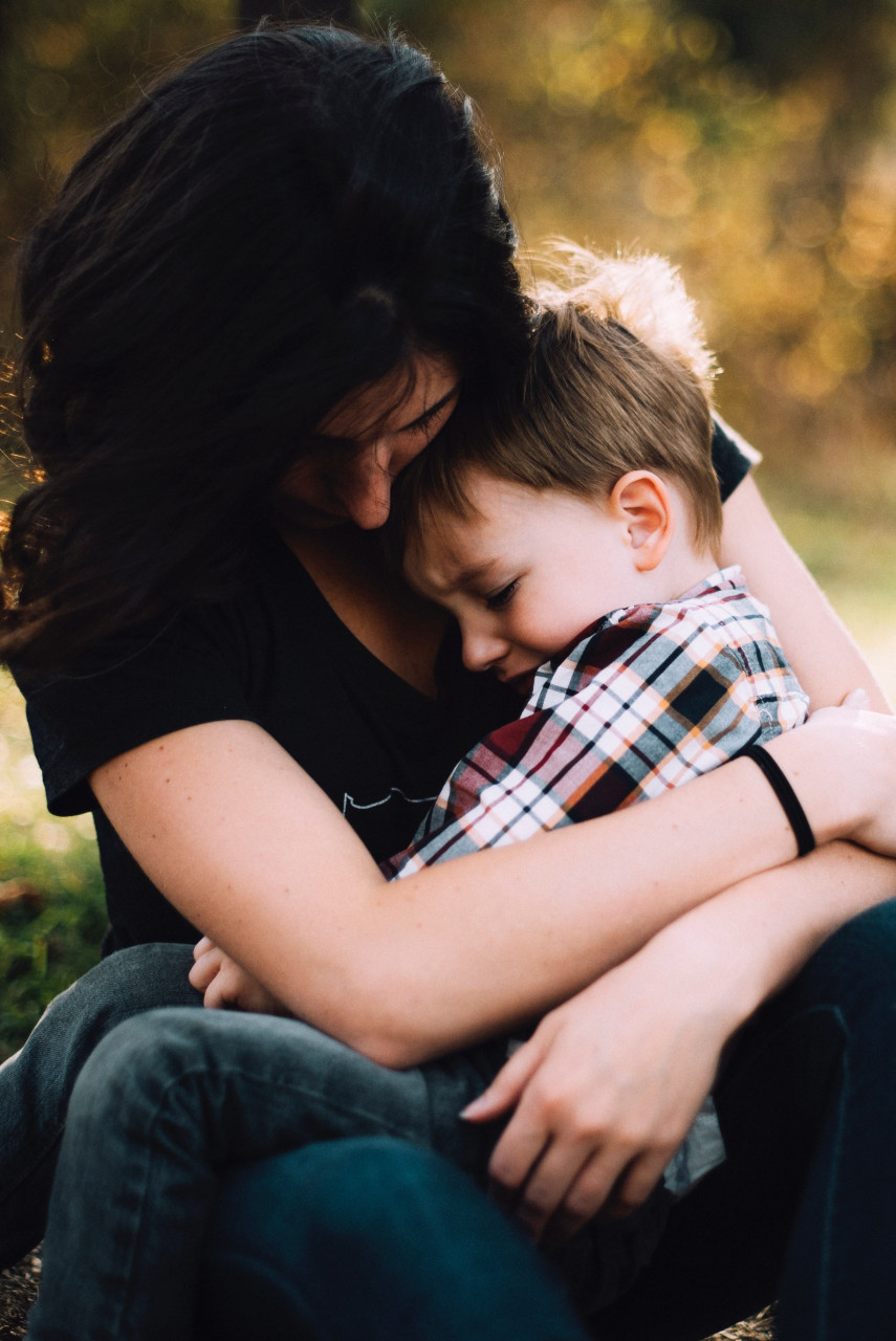 Mother comforting kid