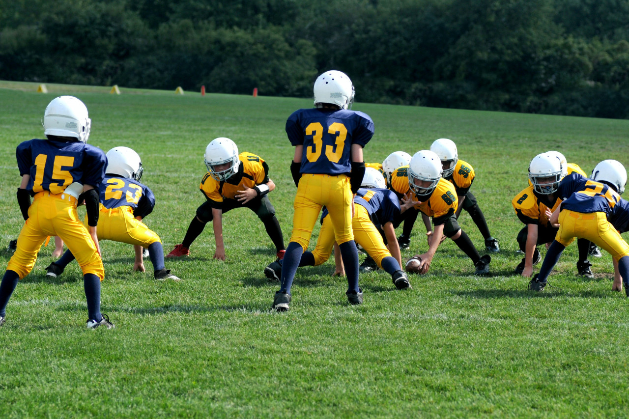 Children playing American football.