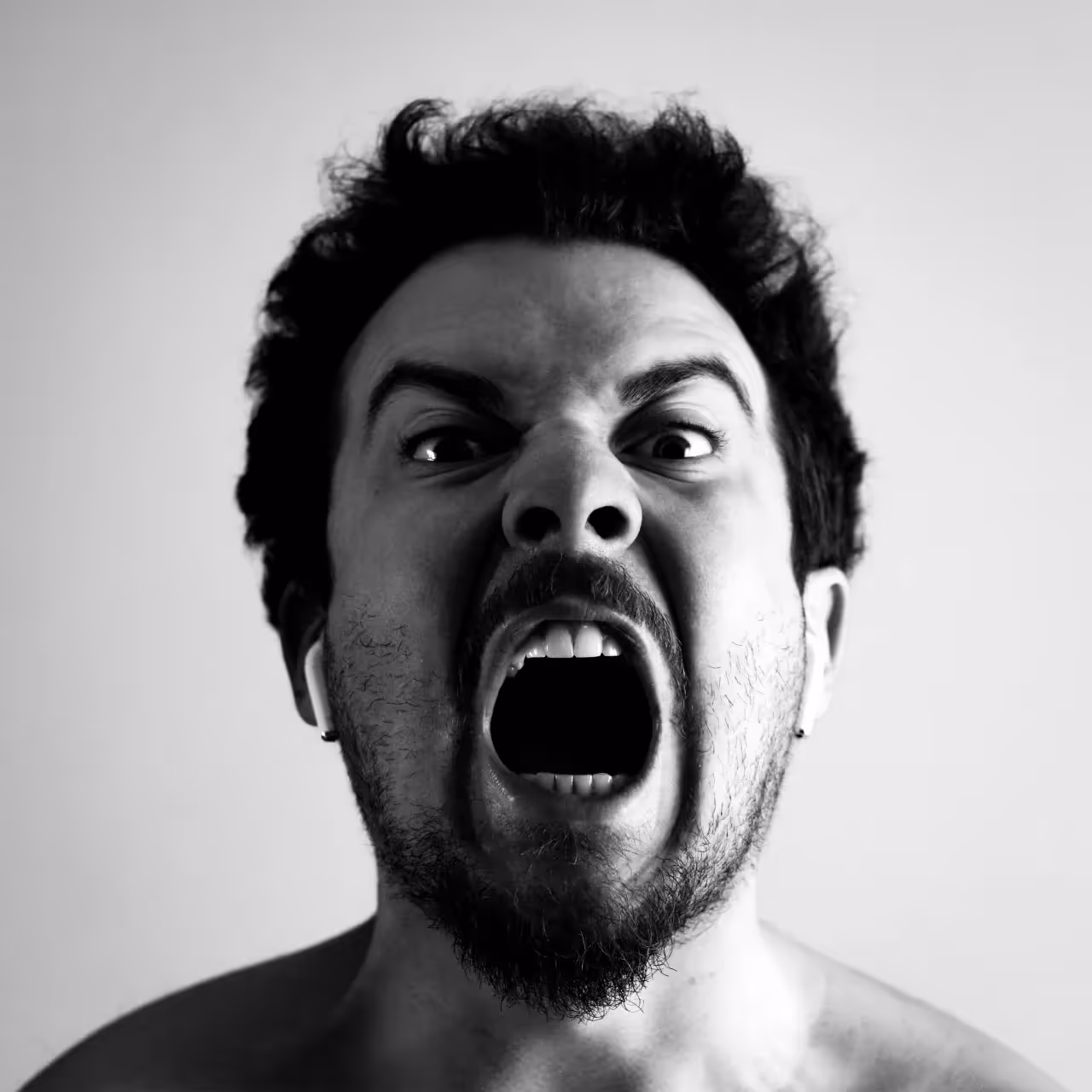 A man shouting in rage.