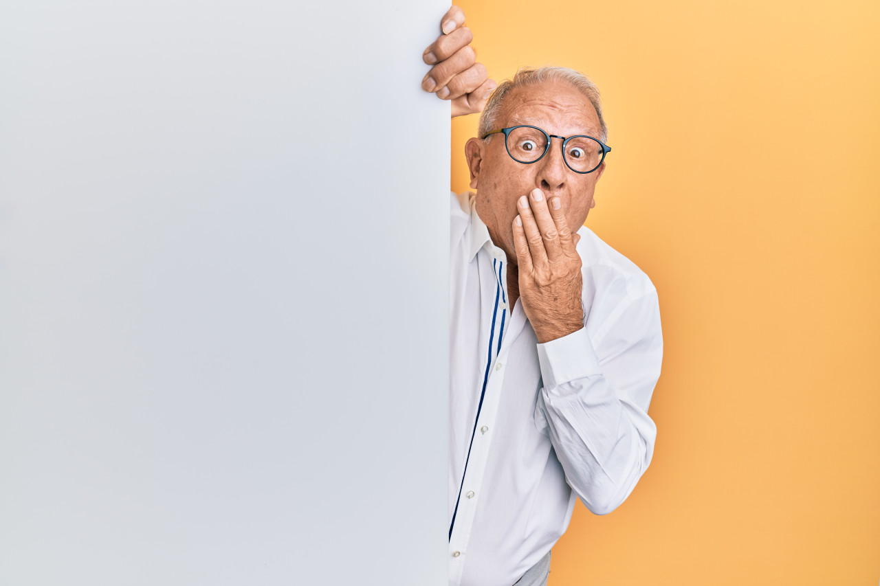 A man telling someone to not talk out about something.