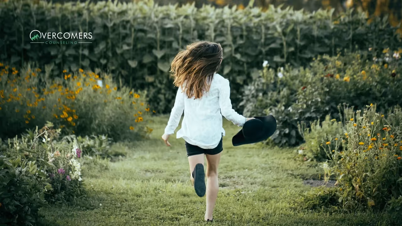 a young child running through a garden