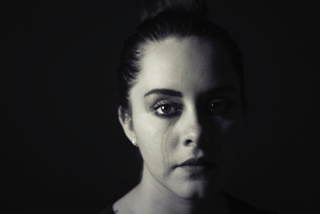 An emotional abuse victim in tears.
