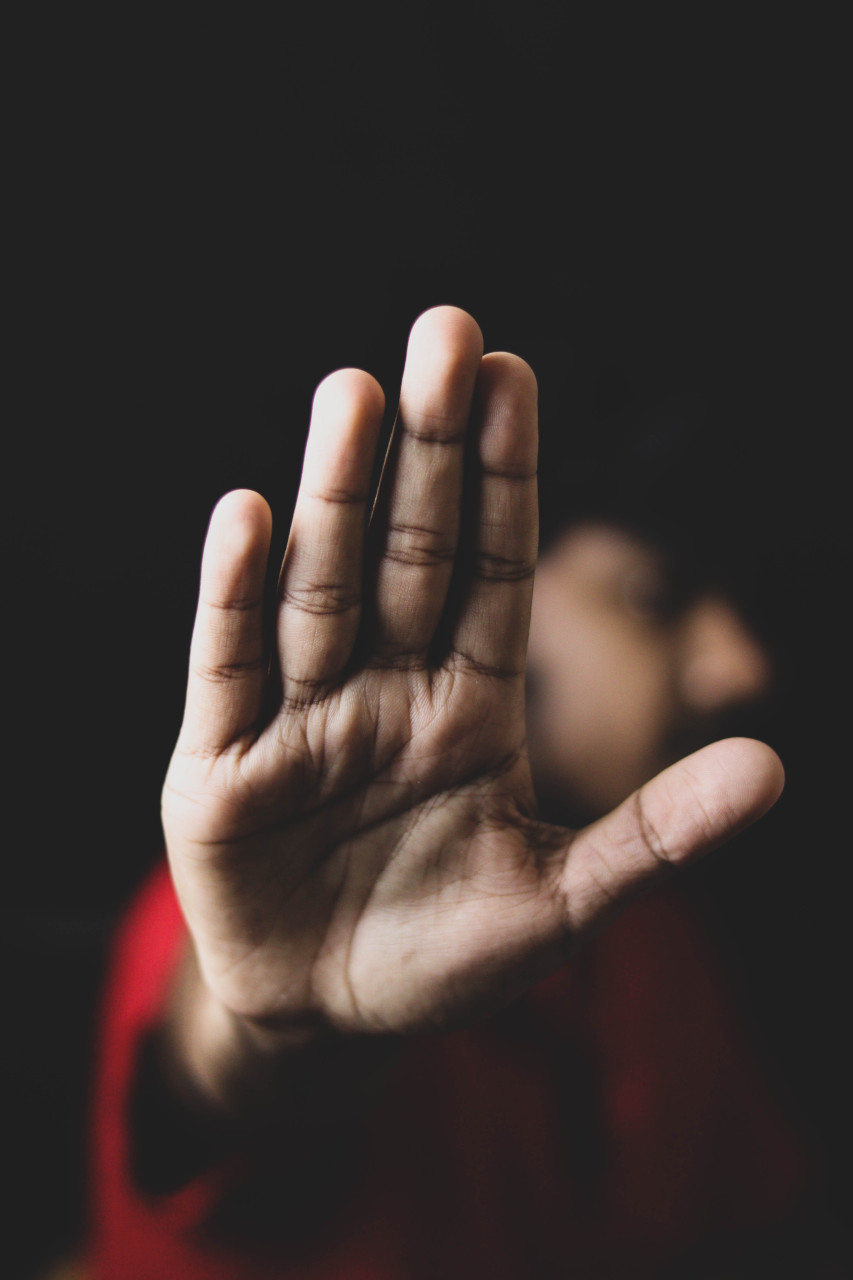 A person telling someone to stop.
