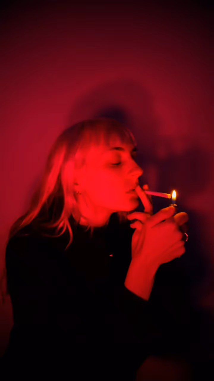 A lady smoking a cigarette.