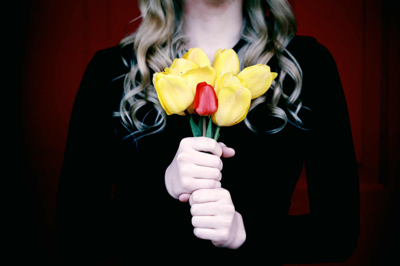 A woman holding flowers.