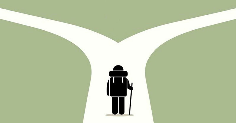 A cartoon image of a person at a fork in the road.