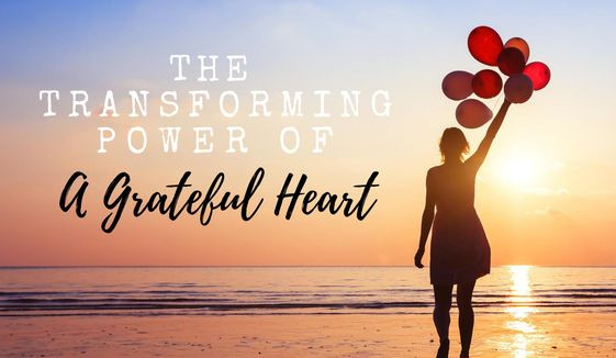 A woman holding ballons and a quote that says The Transforming Power of a Grateful Heart