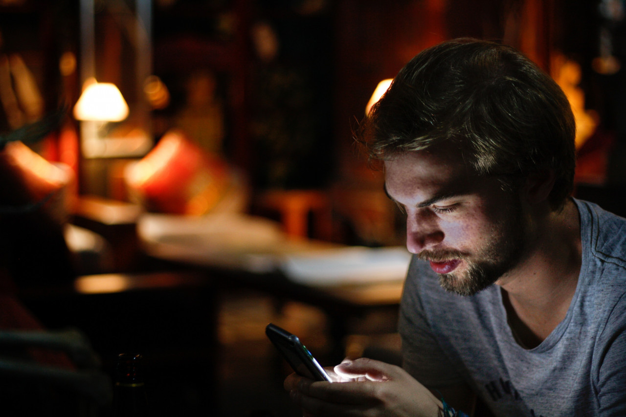 A man looking at his phone