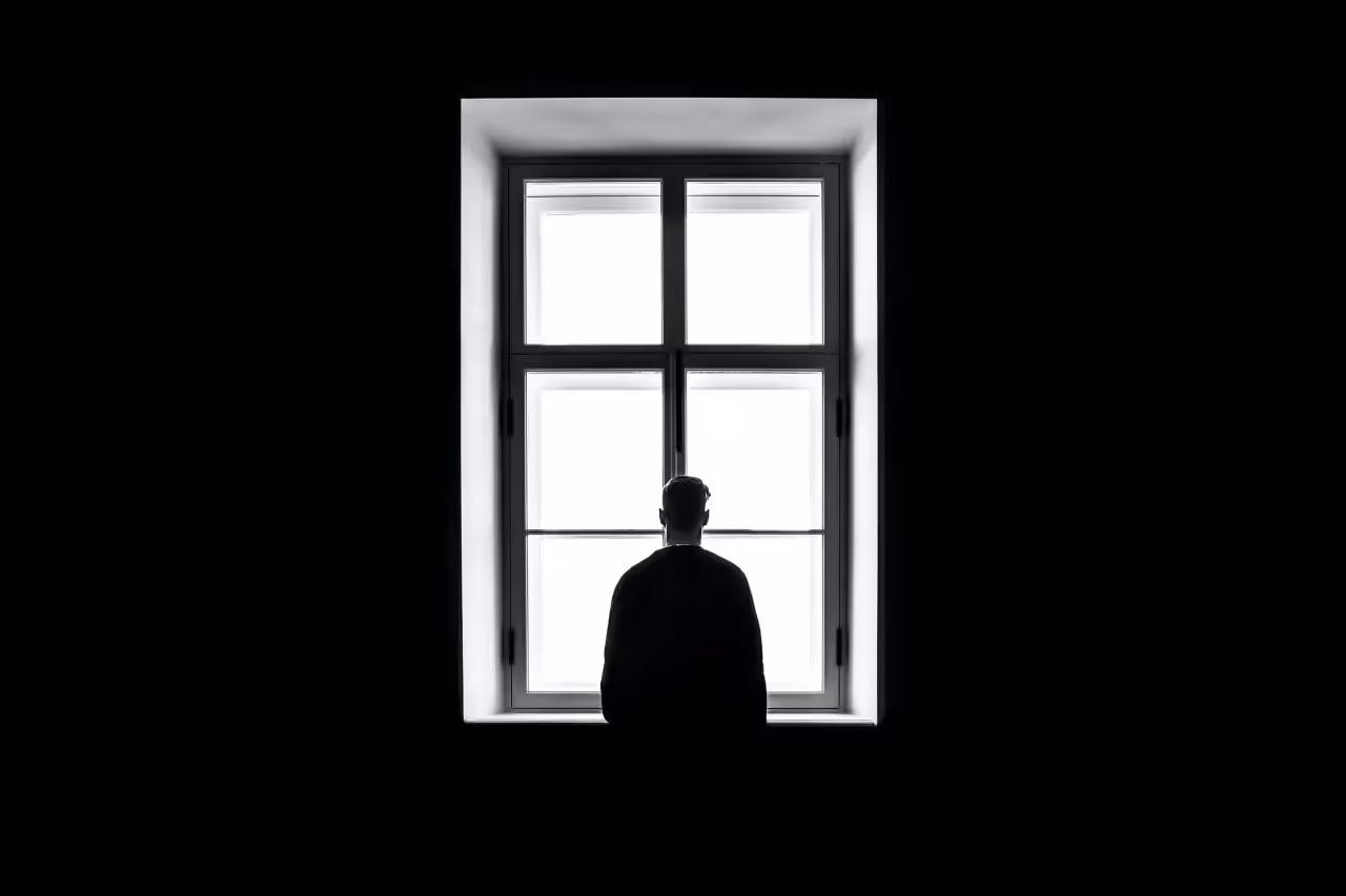 Man standing at a window