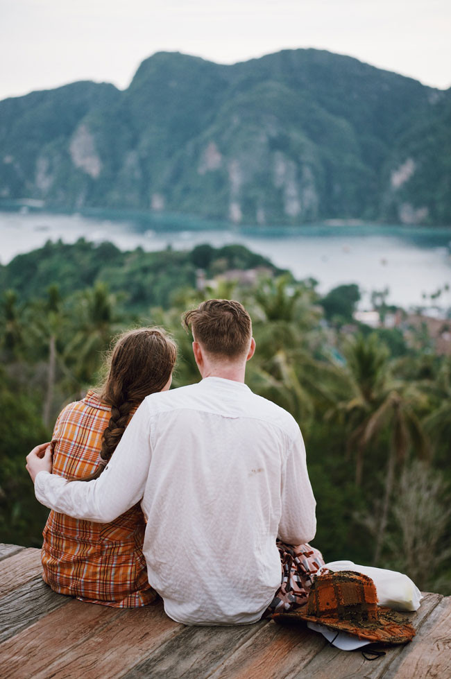 a couple embracing on a cliff