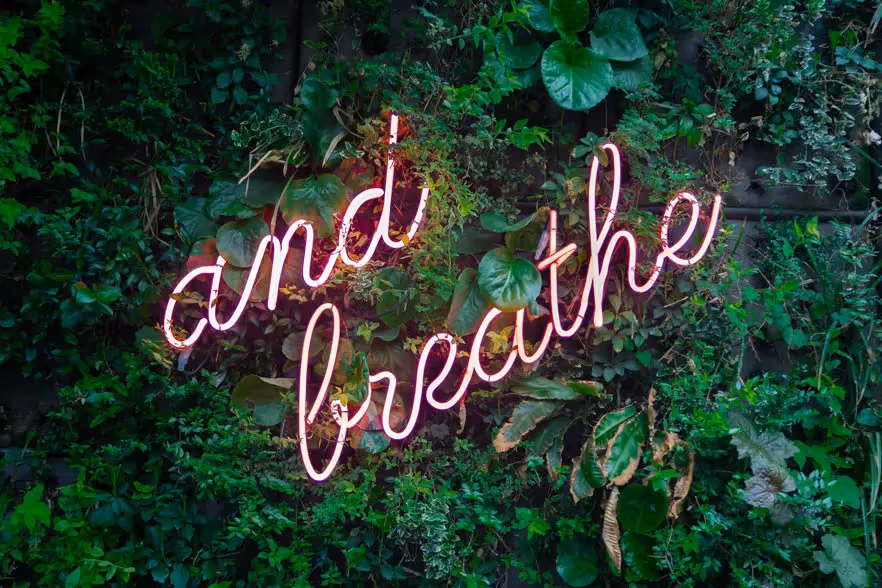 a sign that says and breathe