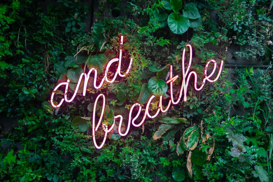a sign that says and breathe