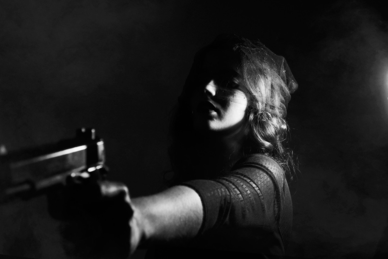 A narcissist threatening someone with a gun.