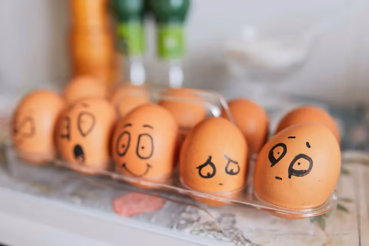 eggs with different facial expressions drawn on them