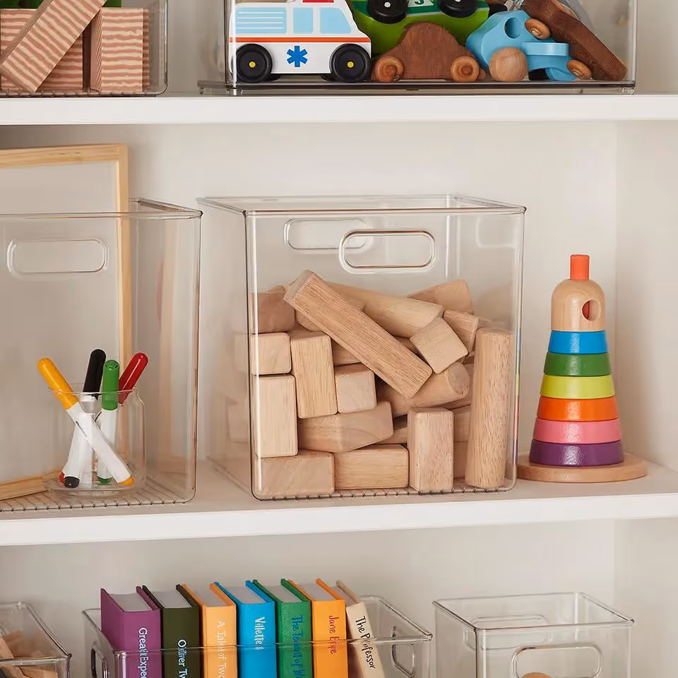 Wooden toys and books organized on shelving units