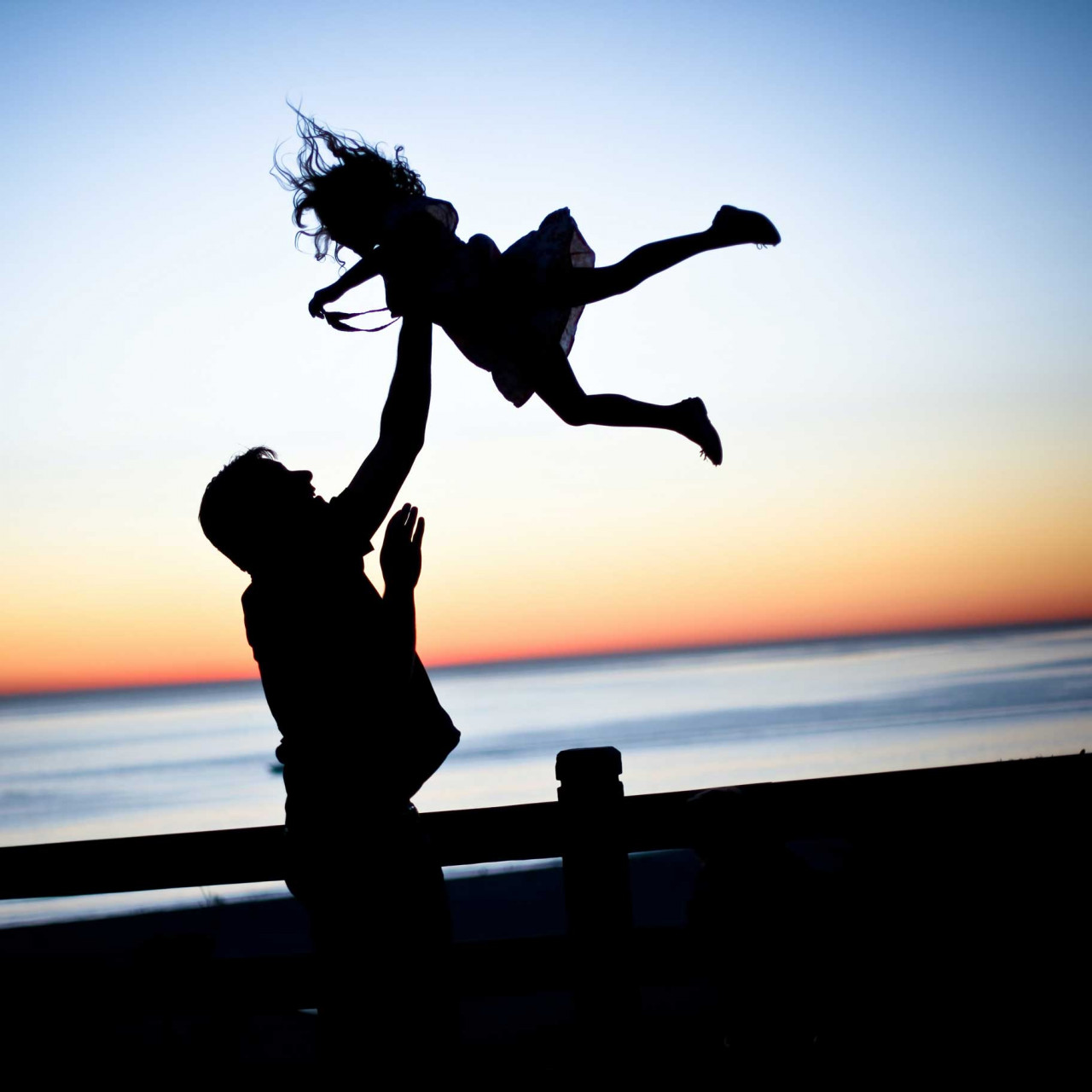 a parent playing with their child